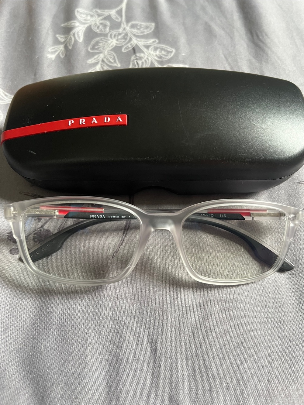 Prada Clear Acetate Men's blue light glasses with Black Temples and Red Detail